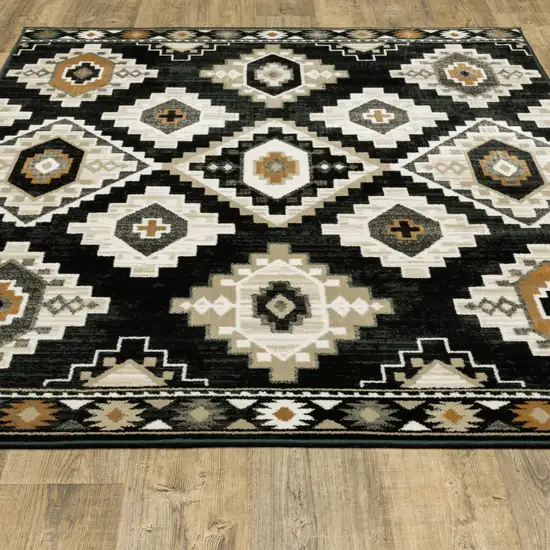 Black Grey Tan Orange And Ivory Southwestern Power Loom Stain Resistant Area Rug Photo 7
