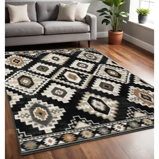 Black Grey Tan Orange And Ivory Southwestern Power Loom Stain Resistant Area Rug Photo 1