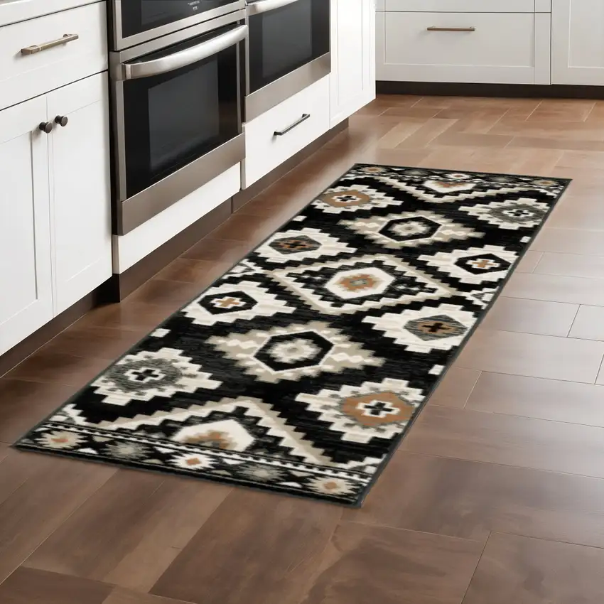 2' X 8' Black Grey Tan Orange And Ivory Southwestern Power Loom Stain Resistant Runner Rug Photo 1