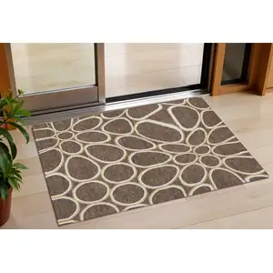 Photo of Black Ivory And Beige Abstract Washable Indoor Outdoor Area Rug