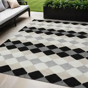 Photo of Black Ivory And Beige Geometric Washable Indoor Outdoor Area Rug