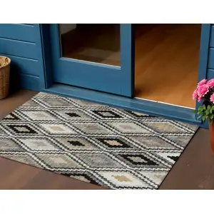 Photo of Black Ivory And Beige Geometric Washable Indoor Outdoor Area Rug