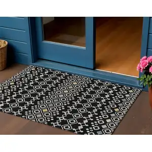 Photo of Black Ivory And Blue Geometric Washable Indoor Outdoor Area Rug