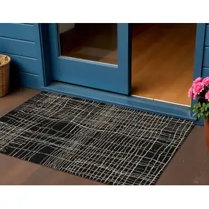 Photo of Black Ivory And Brown Striped Washable Indoor Outdoor Area Rug