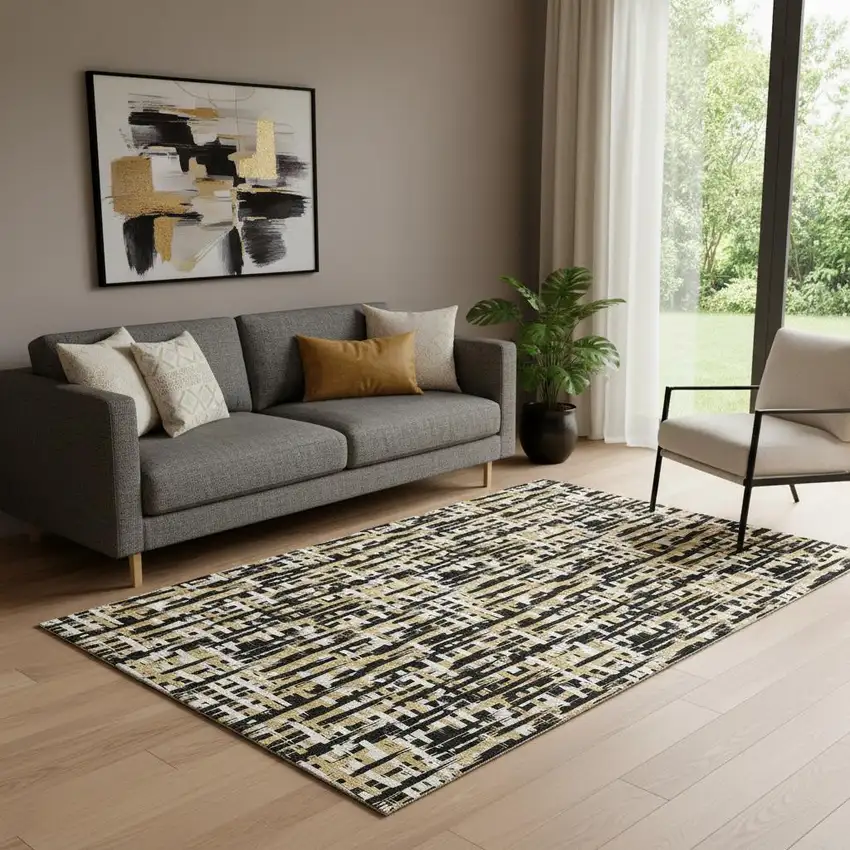 Black Ivory And Gold Abstract Geometric Washable Area Rug With UV Protection Photo 1