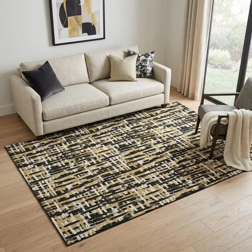 Black Ivory And Gold Abstract Geometric Washable Area Rug With UV Protection Photo 1