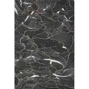 Photo of Black Ivory And Gold Abstract Washable Area Rug With UV Protection