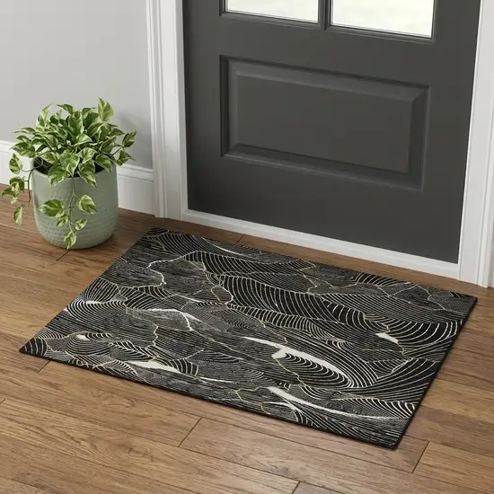 Black Ivory And Gold Abstract Washable Area Rug With UV Protection Photo 1