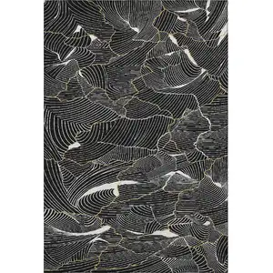 Photo of Black Ivory And Gold Abstract Washable Area Rug With UV Protection
