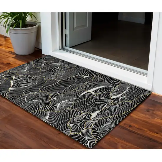 Black Ivory And Gold Abstract Washable Indoor Outdoor Area Rug Photo 1