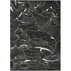 Photo of Black Ivory And Gold Abstract Washable Indoor Outdoor Area Rug