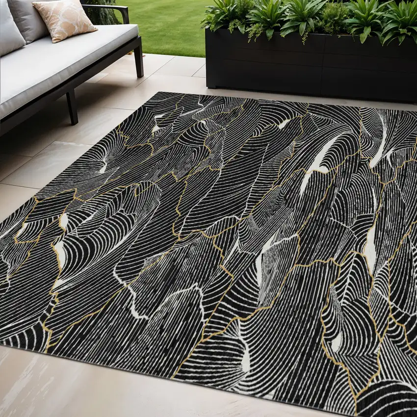 Black Ivory And Gold Abstract Washable Indoor Outdoor Area Rug Photo 1