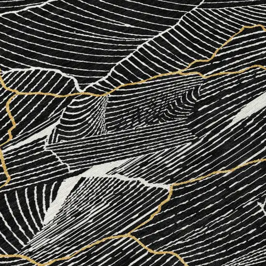 Black Ivory And Gold Abstract Washable Indoor Outdoor Area Rug Photo 4