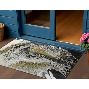 Photo of Black Ivory And Gold Abstract Washable Indoor Outdoor Area Rug