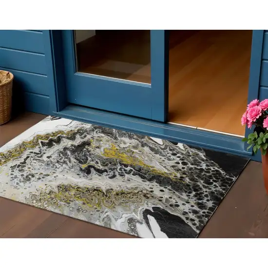 Black Ivory And Gold Abstract Washable Indoor Outdoor Area Rug Photo 1