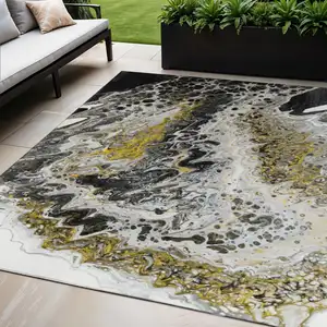 Photo of Black Ivory And Gold Abstract Washable Indoor Outdoor Area Rug