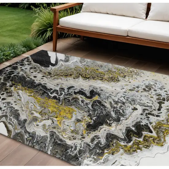 Black Ivory And Gold Abstract Washable Indoor Outdoor Area Rug Photo 1