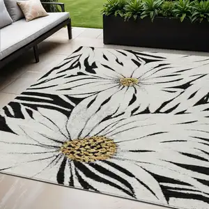Photo of Black Ivory And Gold Floral Washable Indoor Outdoor Area Rug