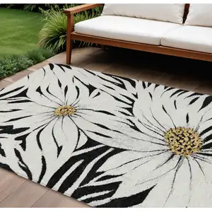 Photo of Black Ivory And Gold Floral Washable Indoor Outdoor Area Rug