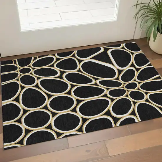 Black Ivory And Gold Geometric Washable Area Rug With UV Protection Photo 1