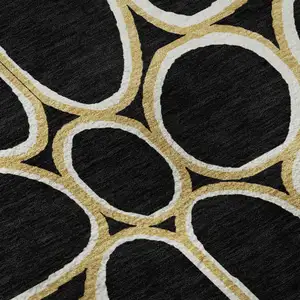 Photo of Black Ivory And Gold Geometric Washable Area Rug With UV Protection