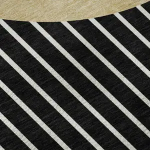 Photo of Black Ivory And Gold Striped Washable Area Rug With UV Protection