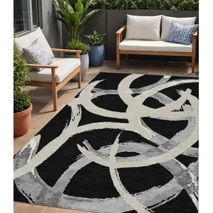 Photo of Black Ivory And Gray Abstract Washable Indoor Outdoor Area Rug