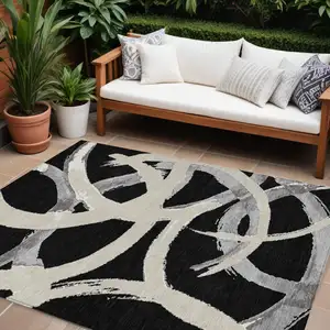 Photo of Black Ivory And Gray Abstract Washable Indoor Outdoor Area Rug