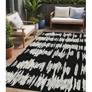 Photo of Black Ivory And Gray Striped Washable Indoor Outdoor Area Rug