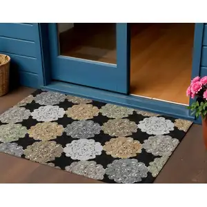 Photo of Black Ivory And Khaki Quatrefoil Washable Indoor Outdoor Area Rug