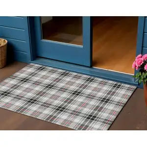 Photo of Black Ivory And Red Plaid Washable Indoor Outdoor Area Rug