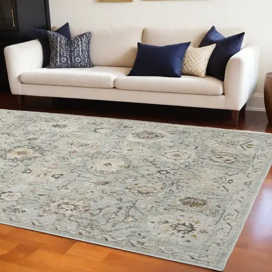 Black Mint Green And Ivory Floral Distressed Area Rug Photo 1