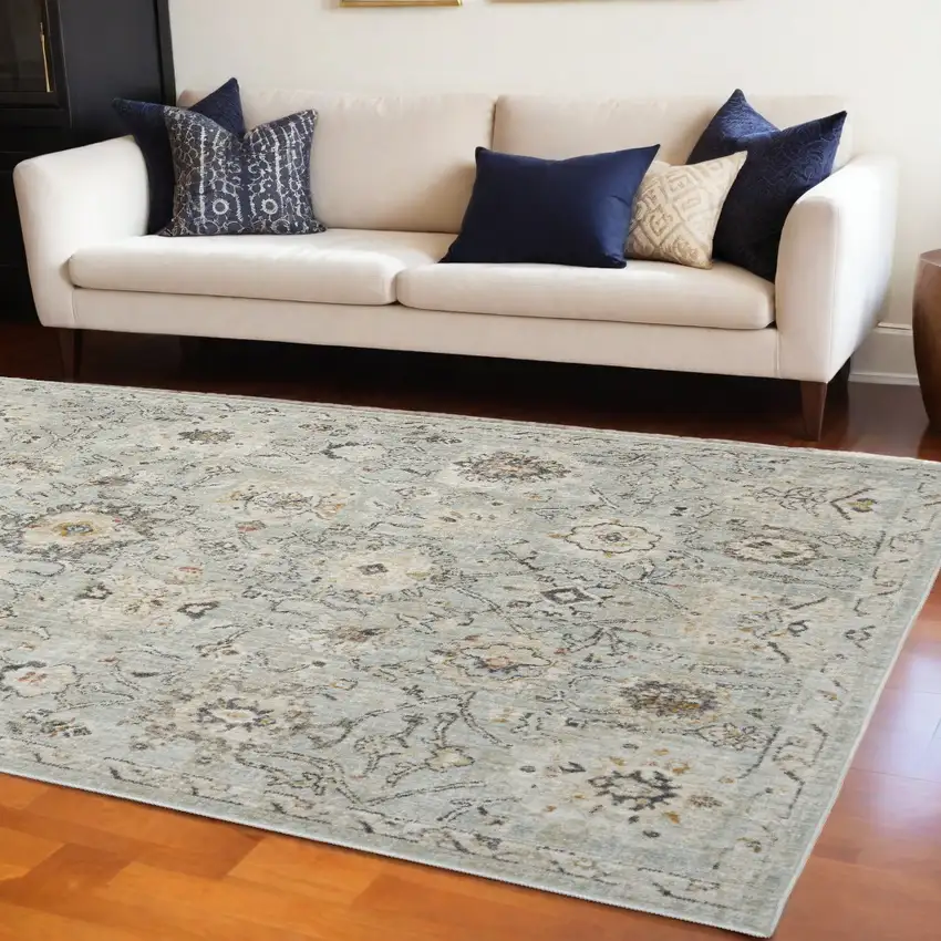 Black Mint Green And Ivory Floral Distressed Area Rug Photo 1