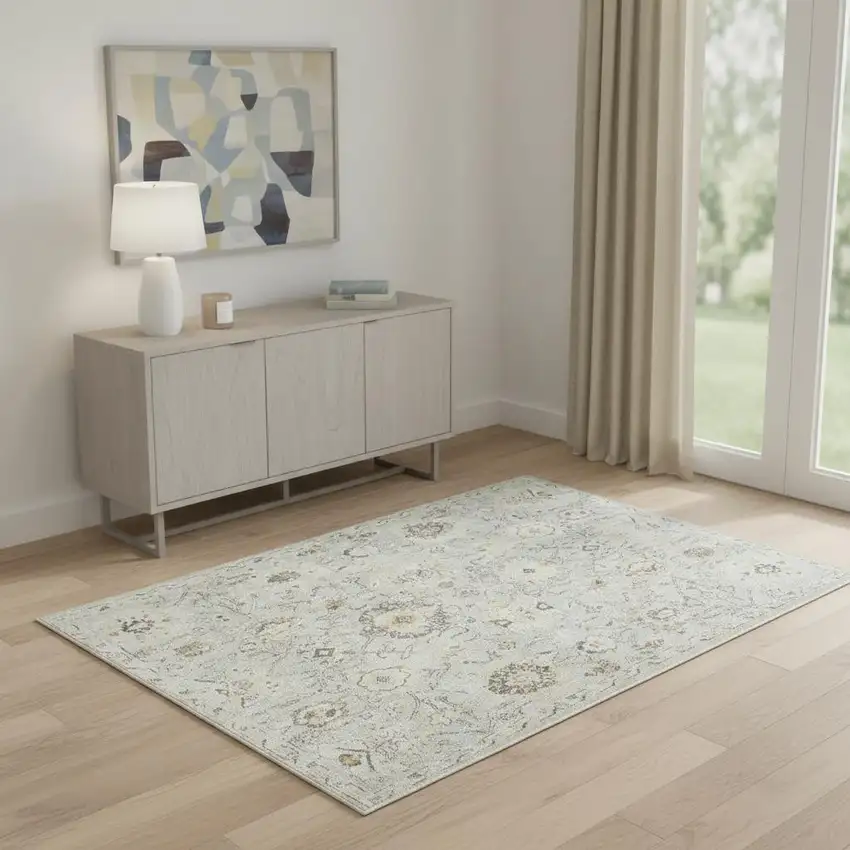 Black Mint Green And Ivory Floral Distressed Area Rug Photo 1