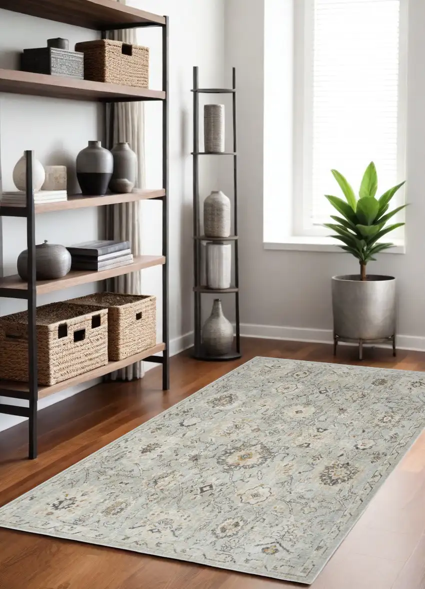 Black Mint Green And Ivory Floral Distressed Area Rug Photo 1