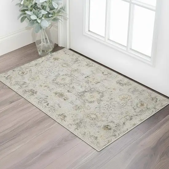 Black Mint Green And Ivory Floral Distressed Area Rug Photo 1