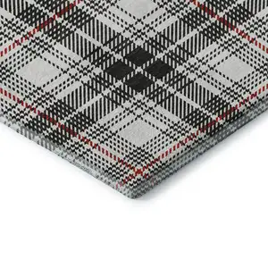 Photo of Black Red And Ivory Plaid Washable Area Rug With UV Protection