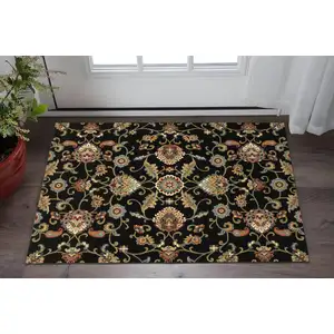 Photo of Black Red Green Ivory Salmon And Yellow Floral Power Loom Stain Resistant Area Rug