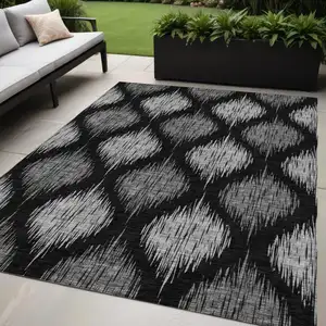 Photo of Black Silver And Gray Ikat Washable Indoor Outdoor Area Rug