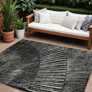 Photo of Black and Ivory Abstract Washable Non Skid Indoor Outdoor Area Rug