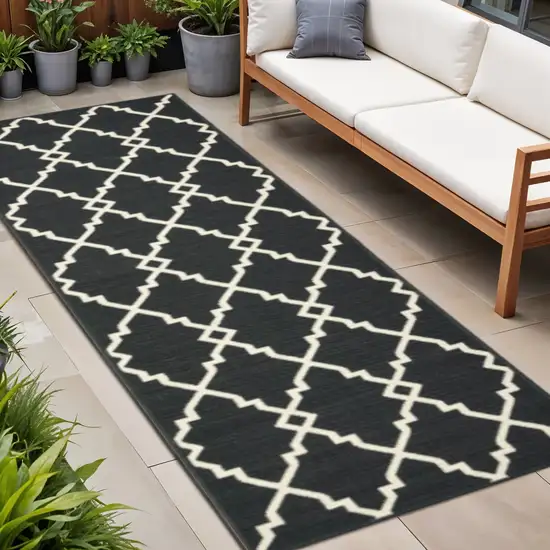 8' Black And Ivory Indoor Outdoor Runner Rug Photo 1
