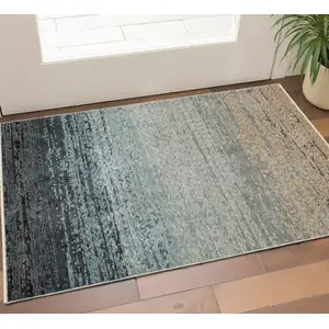 Photo of Blue And Beige Ombre Area Rug With Fringe