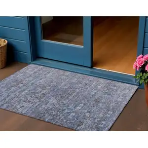 Photo of Blue And Brown Ikat Washable Indoor Outdoor Area Rug