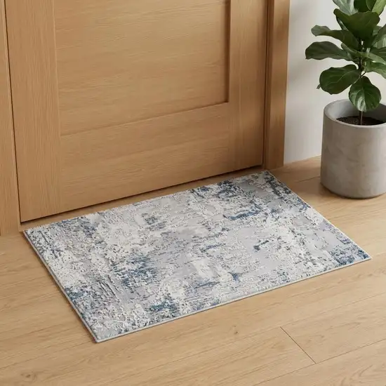 Blue And Cream Abstract Area Rug Photo 1