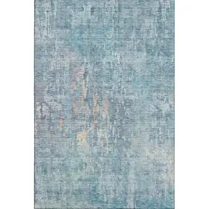 Photo of Blue And Gold Abstract Washable Area Rug With UV Protection