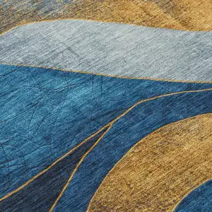Photo of Blue And Gold Abstract Washable Indoor Outdoor Area Rug