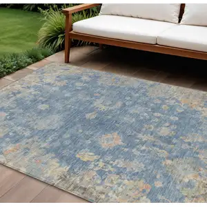 Photo of Blue And Gold Floral Washable Indoor Outdoor Area Rug