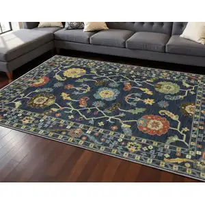 Photo of Blue And Gold Oriental Area Rug With Fringe