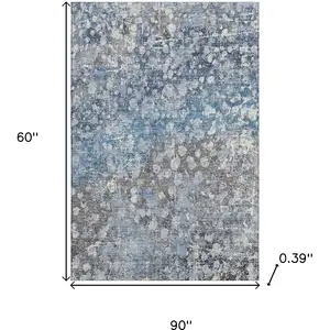 Photo of Blue And Gray Abstract Washable Area Rug With UV Protection