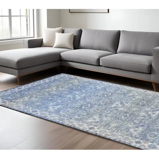 Blue And Ivory Oriental Distressed Area Rug Photo 1